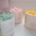 Three scented candles labeled 'ICED MATCHA Latte', 'ICED STRAWBERRY Latte', and 'ICED MANGO Latte' on a white surface.